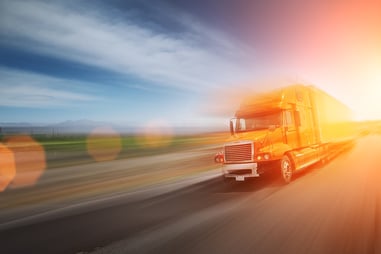 bigstock-Truck-On-Freeway-12557069